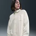Nike Overdimensioneret Nike Sportswear-trøje med jacquard-striber og knaplukning til kvinder - brun