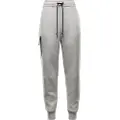 Nike Sportswear Tech Fleece-joggers med mellemhøj talje til kvinder - grå