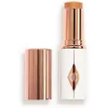 Charlotte Tilbury - Unreal Skin Sheer Glow Tint - Fugtgivende Foundation Stick - Unreal Skin Sheer Glow Tint - 10 - For Women